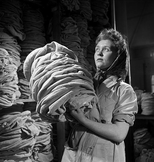 Woman carrying Kangol berets, Cleator, Cumbria, 1948.