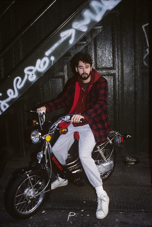 Adam Yauch of the Beastie Boys on a Suzuki moped (1988)